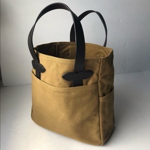 Filson, Made in the U.S.A., Canvas & Leather Tote Bag w/ 4 Exterior Pockets.